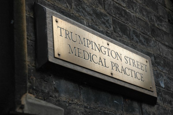 Image of the brass sign outside the practice